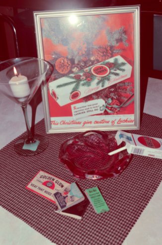 Vintage matchbooks, candy cigarettes, framed vintage ads, and martini glasses transport you to the 1960s in style